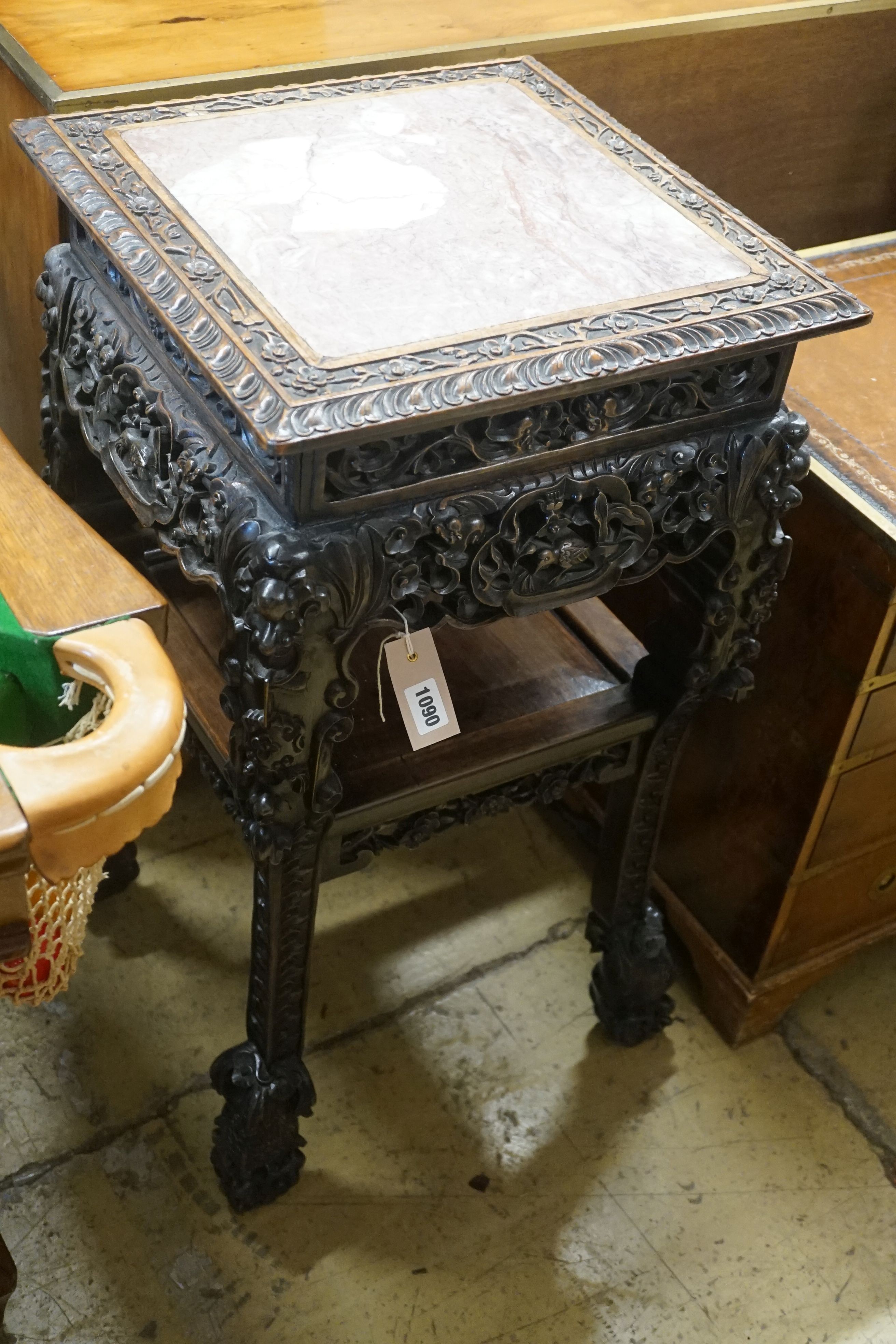 A Chinese carved hardwood two tier jardiniere stand with rouge marble top, width 43cm, depth 43cm, height 80cm